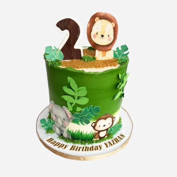 Children's birthday cake with animal-themed decorations on a white background