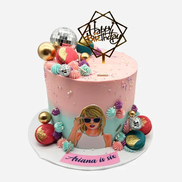 Colorful birthday cake with decorative elements and a portrait of a Taylor Swift 